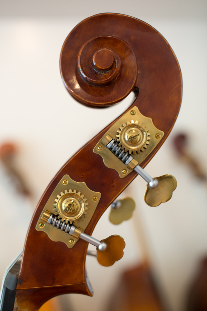 Hand carved upright bass scroll